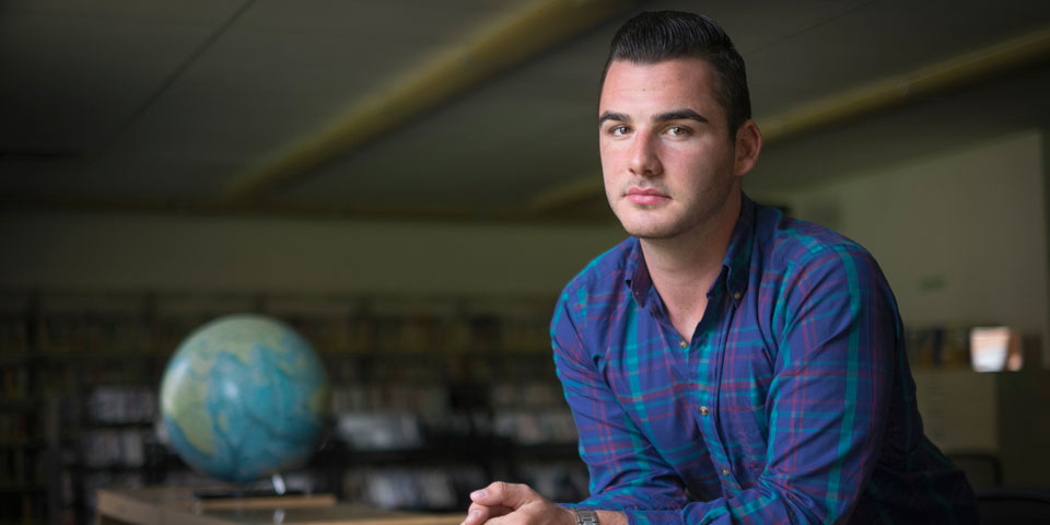 Mason Kramer wearing plaid button shirt